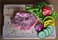 Raw steak with vegetables ready to be cooked on barbecure Royalty Free Stock Photo