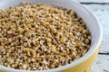 Raw Steel Cut Oats In Yellow Bowl Royalty Free Stock Photo