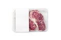 Raw Striploin marbled beef steak vacuum Packed isolated on white Royalty Free Stock Photo