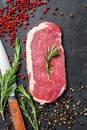 Raw striploin steak or strip New York with herbs. Black background. Top view Royalty Free Stock Photo