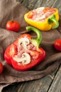 Raw stuffed peppers with minced meat, mushrooms and cherry tomatoes Royalty Free Stock Photo