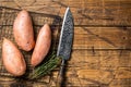 Raw sweet potatoes on kitchen table, fresh batata. Wooden background. Top view. Copy space Royalty Free Stock Photo