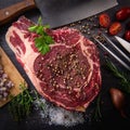 Raw T Bone steak entrecote prepared to Grill on turntable Royalty Free Stock Photo