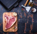 Raw T-bone steak and iron grill pan Royalty Free Stock Photo