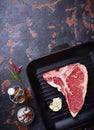 Raw T-bone steak on iron grill pan Royalty Free Stock Photo