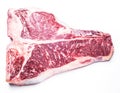 Raw T-bone steak on the white background. Royalty Free Stock Photo