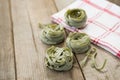 Raw tagliatelle pasta and napkin on wooden surface Royalty Free Stock Photo