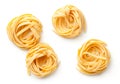 Raw Tagliatelle Pasta Nests Isolated On White Background Royalty Free Stock Photo