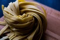 Raw Tagliatelle / Uncooked Pasta or Spaghetti. Royalty Free Stock Photo
