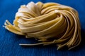 Raw Tagliatelle / Uncooked Pasta or Spaghetti. Royalty Free Stock Photo