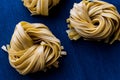 Raw Tagliatelle / Uncooked Pasta or Spaghetti. Royalty Free Stock Photo