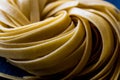 Raw Tagliatelle / Uncooked Pasta or Spaghetti. Royalty Free Stock Photo