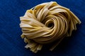Raw Tagliatelle / Uncooked Pasta or Spaghetti. Royalty Free Stock Photo