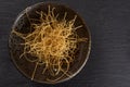 Raw thin noodles on grey stone Royalty Free Stock Photo