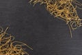 Raw thin noodles on grey stone Royalty Free Stock Photo