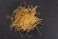 Raw thin noodles on grey stone Royalty Free Stock Photo