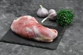 raw three beef steaks on a cutting board with spices on a stone background