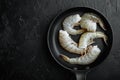 Raw tiger prawns, on black stone background, top view flat lay, with copy space for text Royalty Free Stock Photo