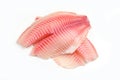 Raw tilapia fillet fish isolated on white background for cooking food - Fresh fish fillet sliced for steak or salad