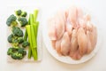 Raw tilapia fish fillet, broccoli, and celery close up on white background Royalty Free Stock Photo