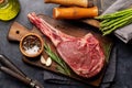 Raw Tomahawk beef steak, asparagus and spices Royalty Free Stock Photo