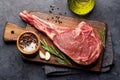 Raw Tomahawk beef steak, asparagus and spices Royalty Free Stock Photo