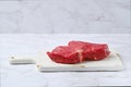 Raw top side beef steak
