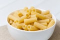 Raw tortiglioni pasta in a white bowl Royalty Free Stock Photo