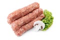 Raw traditional romanian meat rolls Mititei over white background. Royalty Free Stock Photo