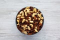 Raw Trail Mix with Nuts and Fruits in a Bowl on a white wooden background, top view. Flat lay, overhead, from above Royalty Free Stock Photo