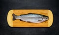 Raw Trout Fish on Wooden Chopping Board