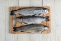 Raw trout on a wooden background Royalty Free Stock Photo