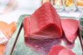 Raw Tuna Fish fillet for sashimi or steak at the fish market. Large assortment of fresh seafood and Tuna fillet. Keto food and Royalty Free Stock Photo