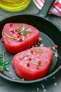 Raw Tuna fish steaks with sea salt, pepper and rosemary Royalty Free Stock Photo