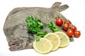 raw turbot fish with lemon slices,cherry tomatoes and parsley isolated on white background Royalty Free Stock Photo