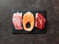 Raw turkey breast fillet, salmon and ribeye Royalty Free Stock Photo