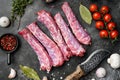 Raw turkey neck without skin, on black dark stone table background, top view flat lay Royalty Free Stock Photo