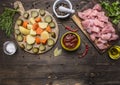 Raw turkey tomato sauce, pepper, spices, herbs ingredients for stew on wooden rustic background top view close up Royalty Free Stock Photo