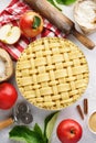 Raw unbaked apple pie with tools and ingredients for cooking Royalty Free Stock Photo