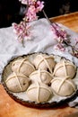 Raw unbaked homemade Easter traditional hot cross buns