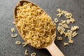 Raw Uncooked Alphabet Pasta in Wooden Spoon Royalty Free Stock Photo