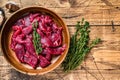 Raw uncooked beef meat sliced in strips with fresh herbs for beef stroganoff. wooden background. Top view. Copy space Royalty Free Stock Photo