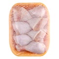 Raw and uncooked chicken drumsticks in a yellow plastic container. Meat of poultry in tray, isolated on white background. Top view Royalty Free Stock Photo