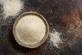 Raw uncooked fonio seeds in a bowl on a dark background Royalty Free Stock Photo