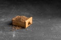 Raw uncooked healthy buckwheat groats in the small wooden box