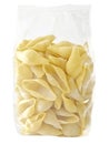 Raw uncooked italian conchiglie jumbo shell pasta in plastic bag