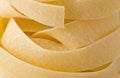 Raw uncooked italian pappardelle pasta noodle