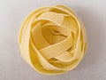 Raw uncooked italian pappardelle pasta noodle