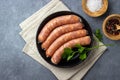 Raw uncooked meat sausages and green herbs Royalty Free Stock Photo