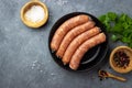 Raw uncooked meat sausages and green herbs Royalty Free Stock Photo